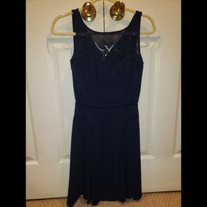 Blue Dress from Paris with Intricate Neckline
